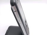 a cell phone that is sitting on top of a stand
