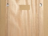 an image of a picture of a wooden frame with a label on it