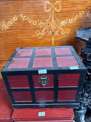a red and black box sitting on top of a table