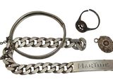 a silver bracelet and a ring with a nameplate on it