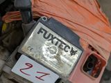 an image of a broken motorcycle with a sign on it