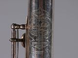 a close up view of a silver plated musical instrument