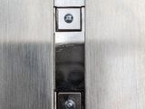 a close up of a stainless steel door with a metal latch