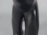 a black sculpture of a bear on a gray background