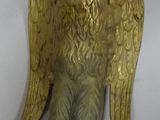 brass statue of an angel with wings on a white background