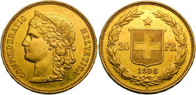 a gold coin with the image of a woman and a cross on it