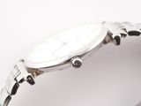 a close up of a wrist watch on a white surface