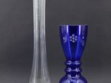 two vases sitting next to each other on a table