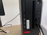 a computer that is sitting on a desk with a keyboard and mouse