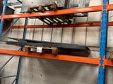 a shelf with a bunch of items on it in a warehouse