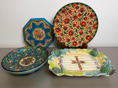 several decorative plates and bowls are sitting on a table