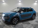 a blue citrole is parked on a checkered floor