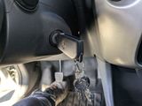 a close up of a car ' s key holder with a car key on it