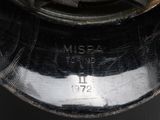 a close up of a black vase with a silver lid