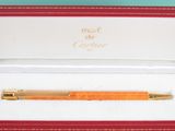 a pen that is sitting in a box on a table