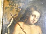 un tableau représentant un jeune garçon tenant un bâton