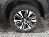 a close up view of a car ' s wheel on the ground