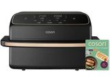 une friteuse à air chaud noire et dorée, avec un livre de recettes à côté