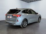 the rear end of a silver 2020 ford edge suv