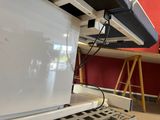 a laptop computer sitting on top of a table