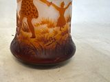 a glass vase with a giraffe design on it