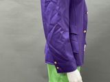 a mannequin wearing a purple jacket and green skirt