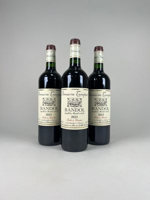 three bottles of wine sitting on top of a table next to each other