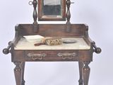 a small table with a mirror and a brush on it