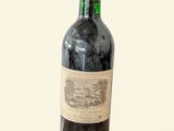 a bottle of wine that is sitting on a table