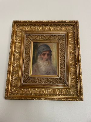 a painting of a bearded man with a turban on the wall
