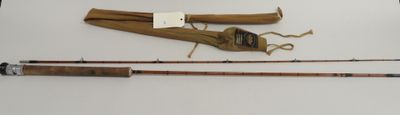 two fishing rods and a fishing bag on a table