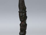 Bâton d'encens chinois en bois sculpté, orné d'une tête sculptée et posé sur un socle