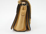 a close up of a purse on a white surface with a white background