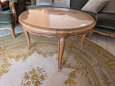 a round table with a glass top in a living room