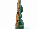 an image of a statue of a woman sitting on a rock