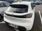 a white car that is parked in a parking lot