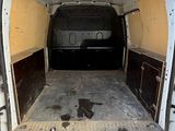 a white van that is parked in a lot