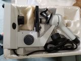 a white box with a microscope and a hair dryer in it