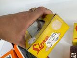 a person that is holding a box with some food in it