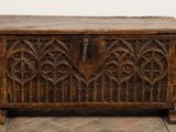 an old wooden chest sitting on top of a wooden floor