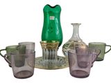 a lot of different colored glass items on the table