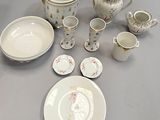 a table with a lot of dishes and cups on it