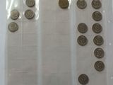 a lot of coins in a plastic bag on a table
