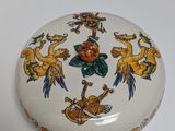 a white box with a design of animals and birds on it