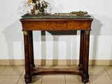 an image of a small table with a plant on top of it