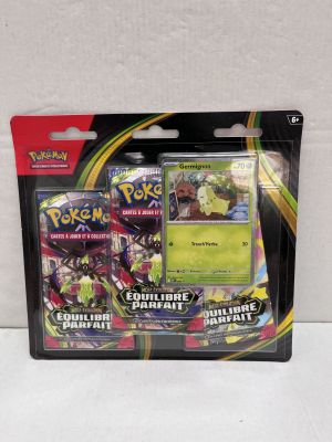 a close up of a box of pokemon cards on a white surface