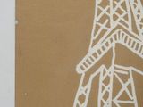 an image of a picture of the eiffel tower on a brown paper