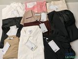 a lot of men ' s shirts on display in a box