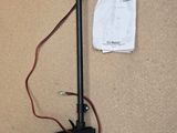 an image of a small outboard motor with a battery attached