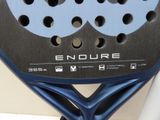 a close up of a tennis racket with holes in it